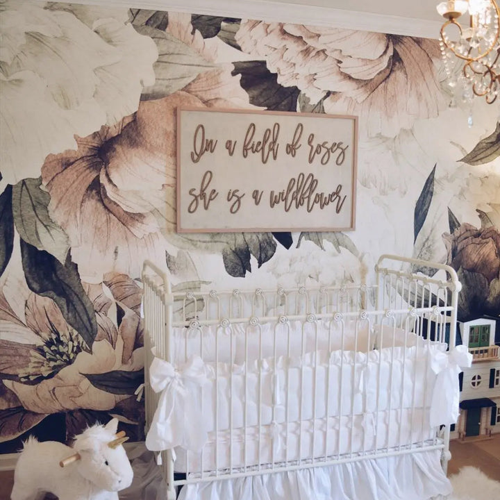 Soft blush pink oversized peony floral wallpaper mural with watercolor style leaves, printed on peel and stick or pre-pasted removable wallpaper, ideal for nurseries, bedrooms, or feature walls.