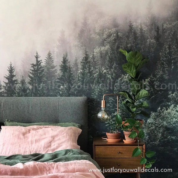 Misty pine forest mural wallpaper with layers of green trees fading into fog.