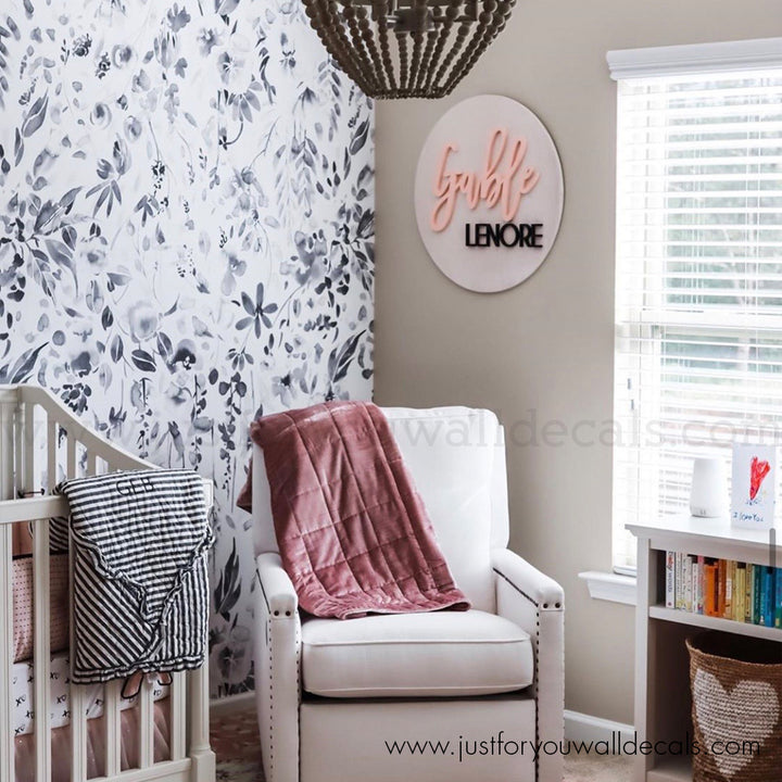 Artistic black, white, and grey floral wallpaper with cascading watercolor blooms and leaves, printed on premium removable wallpaper for easy installation.