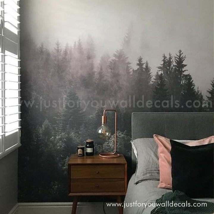 Misty pine forest mural wallpaper with layers of green trees fading into fog.